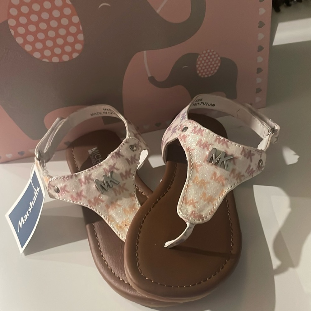 NWT. Micheal Kors Sandal in size: 10